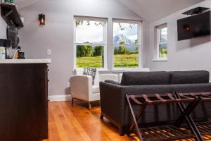 a living room with a couch and a chair at Hillside Colorado Cottages in Hillside