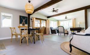 a living room with a table and chairs at Hillside Colorado Cottages in Hillside