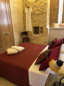 Postel nebo postele na pokoji v ubytování Borgo in corte