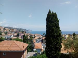 a view of a city with a tree at Camera con vista in San Lorenzo al Mare