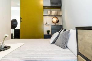 Katil atau katil-katil dalam bilik di ALTIDO Exclusive Apt for 4 in Navigli near parks
