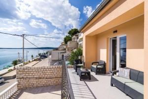 a balcony with a view of the water at Apartment NewCity in Novigrad Dalmatia