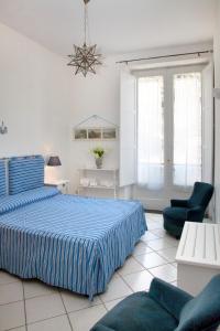 Säng eller sängar i ett rum på Brasca Amalfi Rosa Canina
