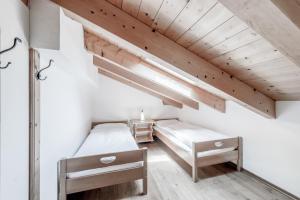 Postel nebo postele na pokoji v ubytování Boutique Hotel Cervus