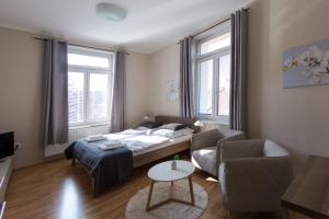Postel nebo postele na pokoji v ubytování Penzion Apartmány Resident
