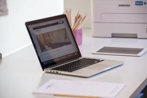 a laptop computer sitting on top of a desk at Akroyiali Resort in Vasiliki