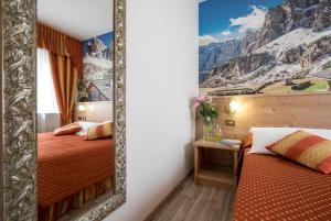 Postel nebo postele na pokoji v ubytování Hotel Touring