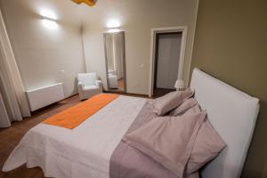 Postel nebo postele na pokoji v ubytování Domus Hyblaea Resort