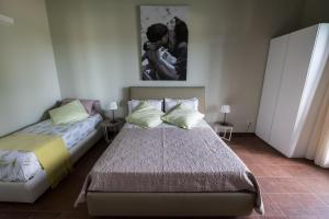 Postel nebo postele na pokoji v ubytování Domus Hyblaea Resort