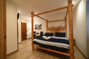 Rúm í herbergi á Hotel Pangrazzi - 3 stelle superior