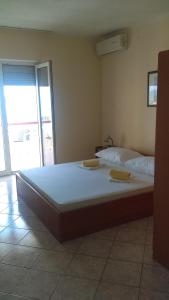 Posteľ alebo postele v izbe v ubytovaní Guesthouse BILI