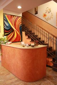 a reception area of a store with a staircase at Hotel San Giovanni in Milan