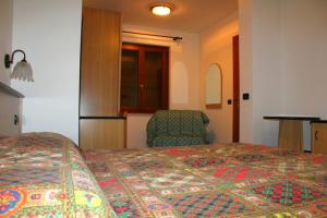 Rúm í herbergi á albergo ristorante le fontane