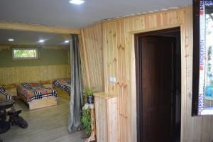 A bed or beds in a room at Qusha Guesthouse Meeting in the mountains and views