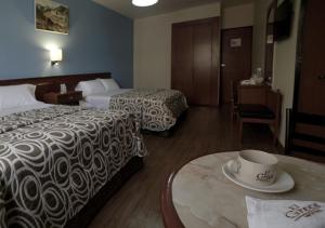 Postel nebo postele na pokoji v ubytování Hotel El Greco