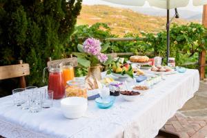 a white table with food and drinks on it at Maelka Belvedere in Agropoli