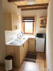 Kuchyň nebo kuchyňský kout v ubytování Cottage Family