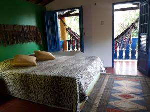 Giường trong phòng chung tại Casa Jasmine Taíba