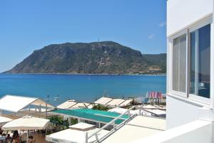 a view of a beach and the ocean from a building at APARTMENTS kokalaki in Kefalos