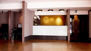 a lobby with a reception desk in a building at Poste 43 Residence in Bangkok