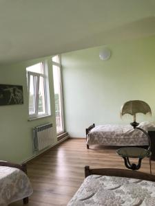 Postel nebo postele na pokoji v ubytování COMMUNE hotel