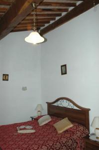 A bed or beds in a room at Agriturismo Podere Molino
