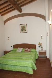 A bed or beds in a room at Agriturismo Podere Molino