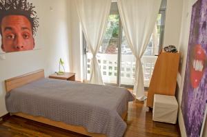 Ένα ή περισσότερα κρεβάτια σε δωμάτιο στο Villa Serenity