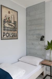 Postel nebo postele na pokoji v ubytování Pokoje i Apartamenty Poddąbie 2