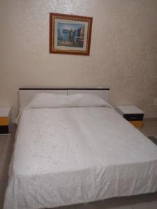 Postel nebo postele na pokoji v ubytování Anema e Core Pizzo
