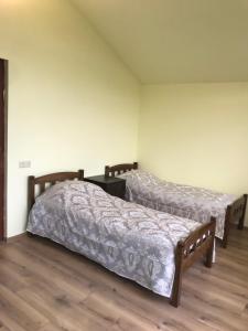 Postel nebo postele na pokoji v ubytování COMMUNE hotel