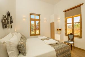 Postel nebo postele na pokoji v ubytování Aelios Design Hotel