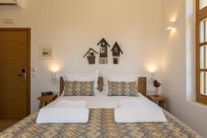 Postel nebo postele na pokoji v ubytování Aelios Design Hotel