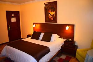 Postel nebo postele na pokoji v ubytování Endamo Hotel