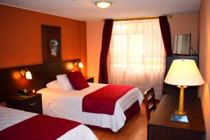 Postel nebo postele na pokoji v ubytování Endamo Hotel