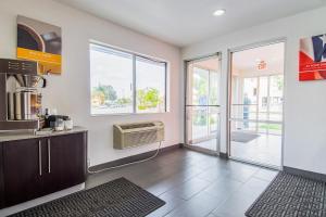 a room with a kitchen with a air conditioner at Motel 6-Bakersfield, CA - Airport in Bakersfield