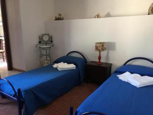 Letto o letti in una camera di Villino Fraginesi