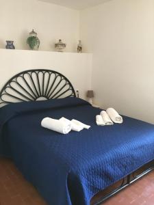 Letto o letti in una camera di Villino Fraginesi
