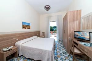 Lova arba lovos apgyvendinimo įstaigoje Hotel Casa Di Meglio