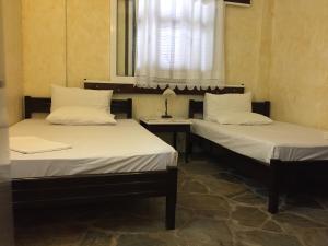 En eller flere senger på et rom på Sotiroulis Apartments