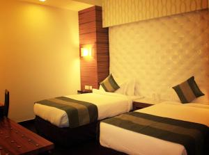 Postel nebo postele na pokoji v ubytování Hotel Ivory 32