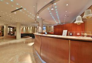 a lobby with a bar in a hotel at Best Western Hotel Cappello d'Oro in Bergamo