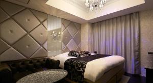Postel nebo postele na pokoji v ubytování HOTEL EXE (Adult Only)