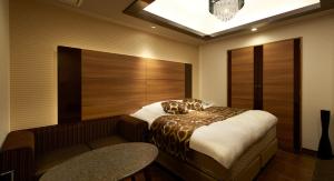 Postel nebo postele na pokoji v ubytování HOTEL EXE (Adult Only)