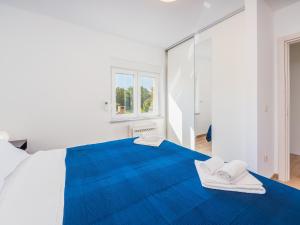 Łóżko lub łóżka w pokoju w obiekcie Appartments Adriatic