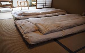 A bed or beds in a room at Kamiobo