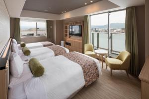 Postel nebo postele na pokoji v ubytování HOTEL MYSTAYS Kyoto Shijo