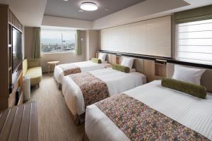 Postel nebo postele na pokoji v ubytování HOTEL MYSTAYS Kyoto Shijo