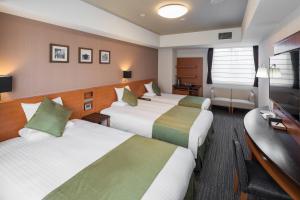 Postel nebo postele na pokoji v ubytování HOTEL MYSTAYS Kyoto Shijo