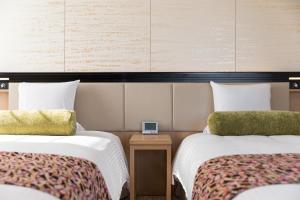 Postel nebo postele na pokoji v ubytování HOTEL MYSTAYS Kyoto Shijo